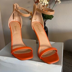 Nude with orange heels